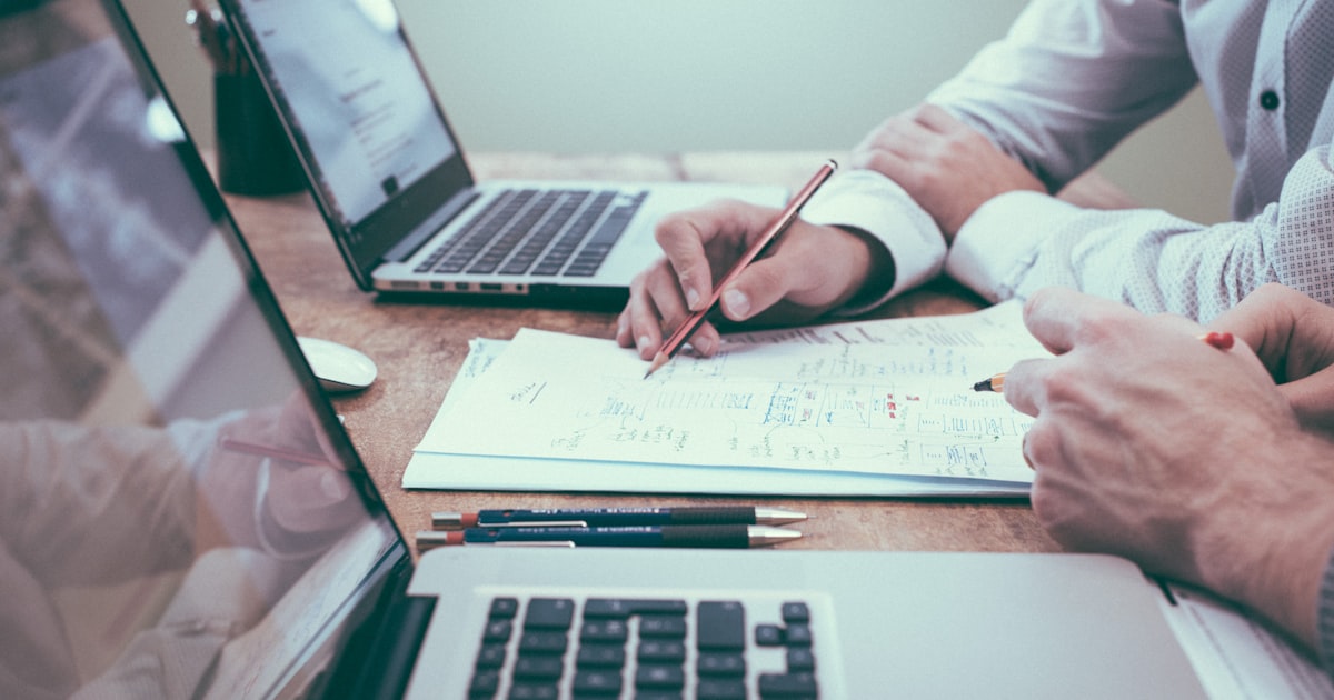 Professional reviewing business proposal and quote documents