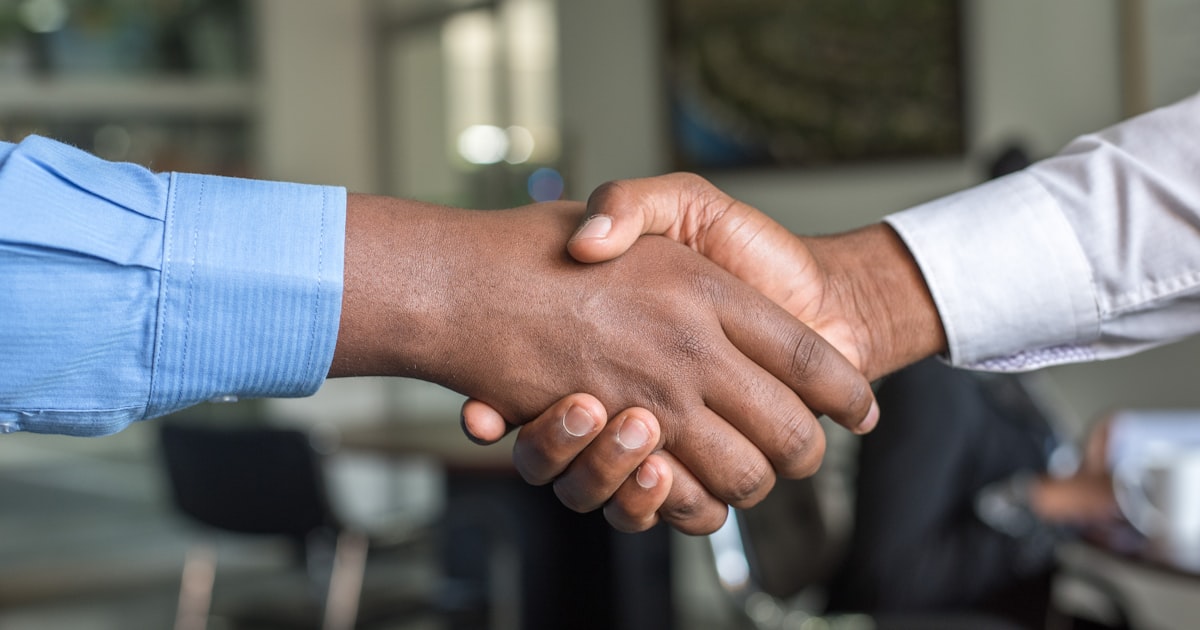 Business handshake representing freelance contract agreement