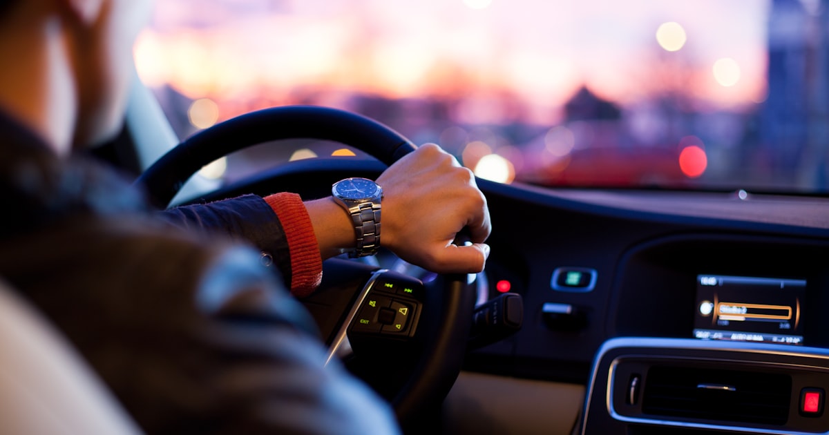Car on road representing business mileage tracking for freelancers